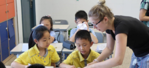 Teacher helping her learners 