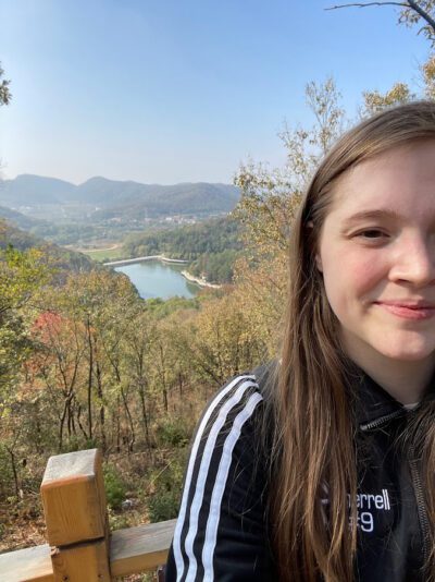 Teacher in Wuhan with scenic background