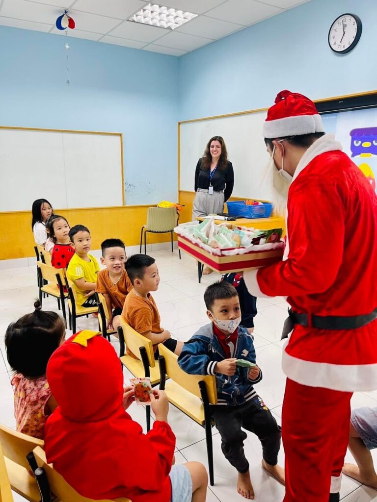 English teacher in a Vietnamese classroom celebrating Christmas