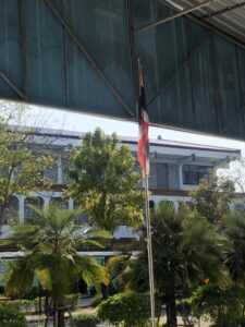 Thai flag being raised at a school in Thailand 