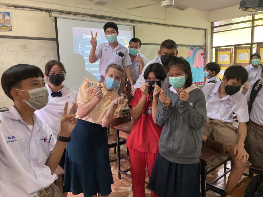 English teacher with a group of students in a Thai classroom