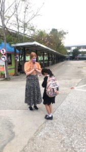 English teacher in Thailand and a student wai