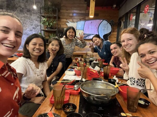 Grougroup of people eating together in Thailand