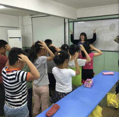 class of students and their teacher having fun in Xuzhou, China