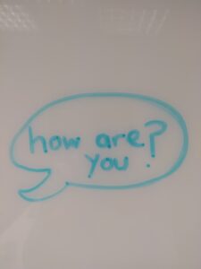 "How are you" written on a whiteboard