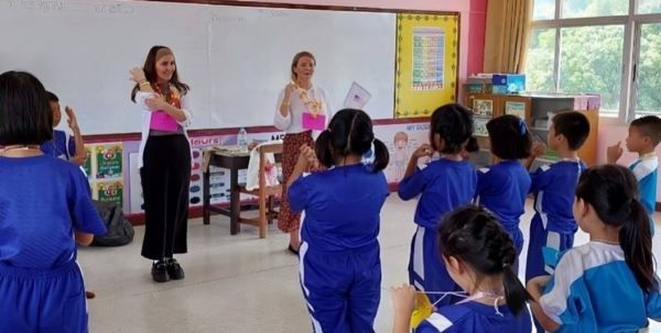Two female teachers in a classroom in Thailand