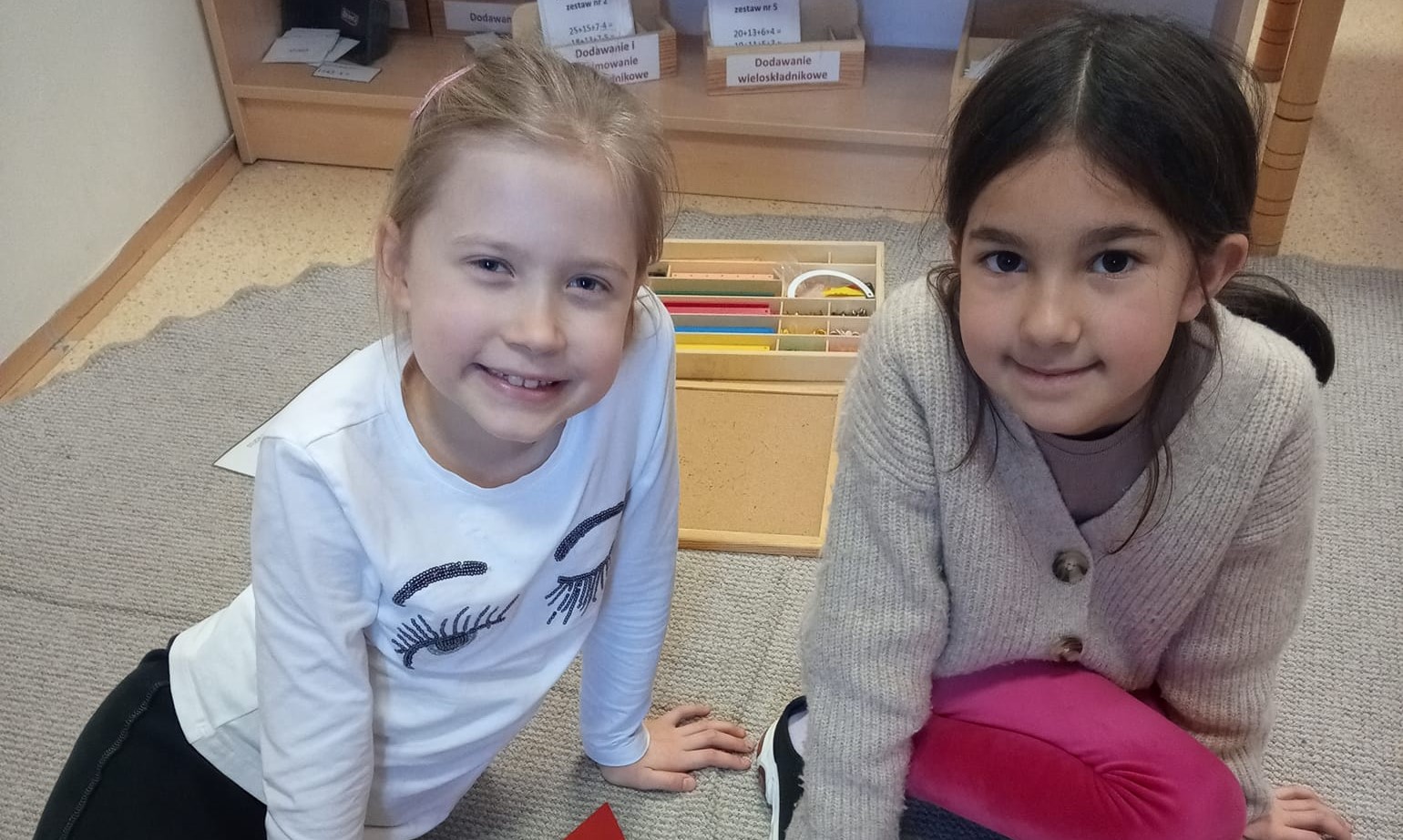 Two young learners at a Montessori primary school in Poznan
