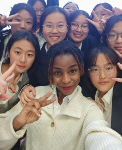 teacher surrounded by Chinese students 