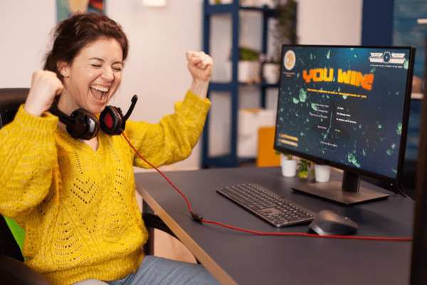 Woman in front of a computer working on an ESL lesson