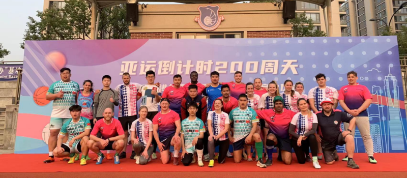 Group of people posing for a photo after playing sports in China