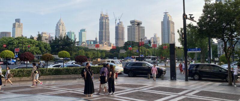 Clean streets of Shanghai, with the skyline in the background.