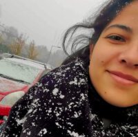 Woman in Budapest smiling in the snow