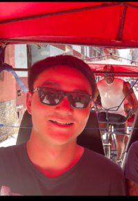 Chinese man smiling on holiday