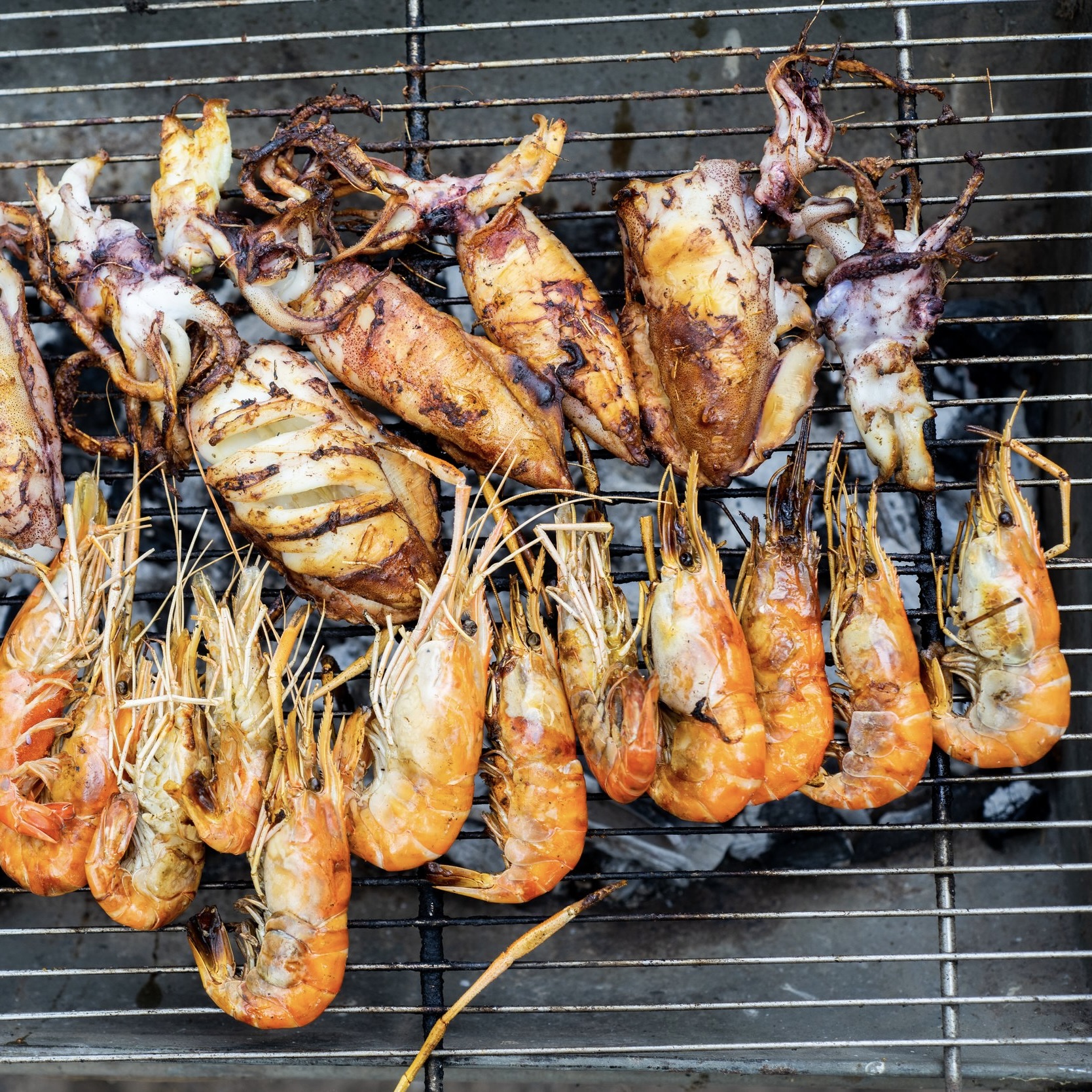 shrimp, squid Barbecue Grill cooking seafood. background eat Restaurant Top view.
