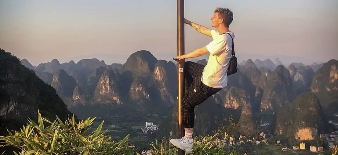 Man climbing in China's mountains and having fun